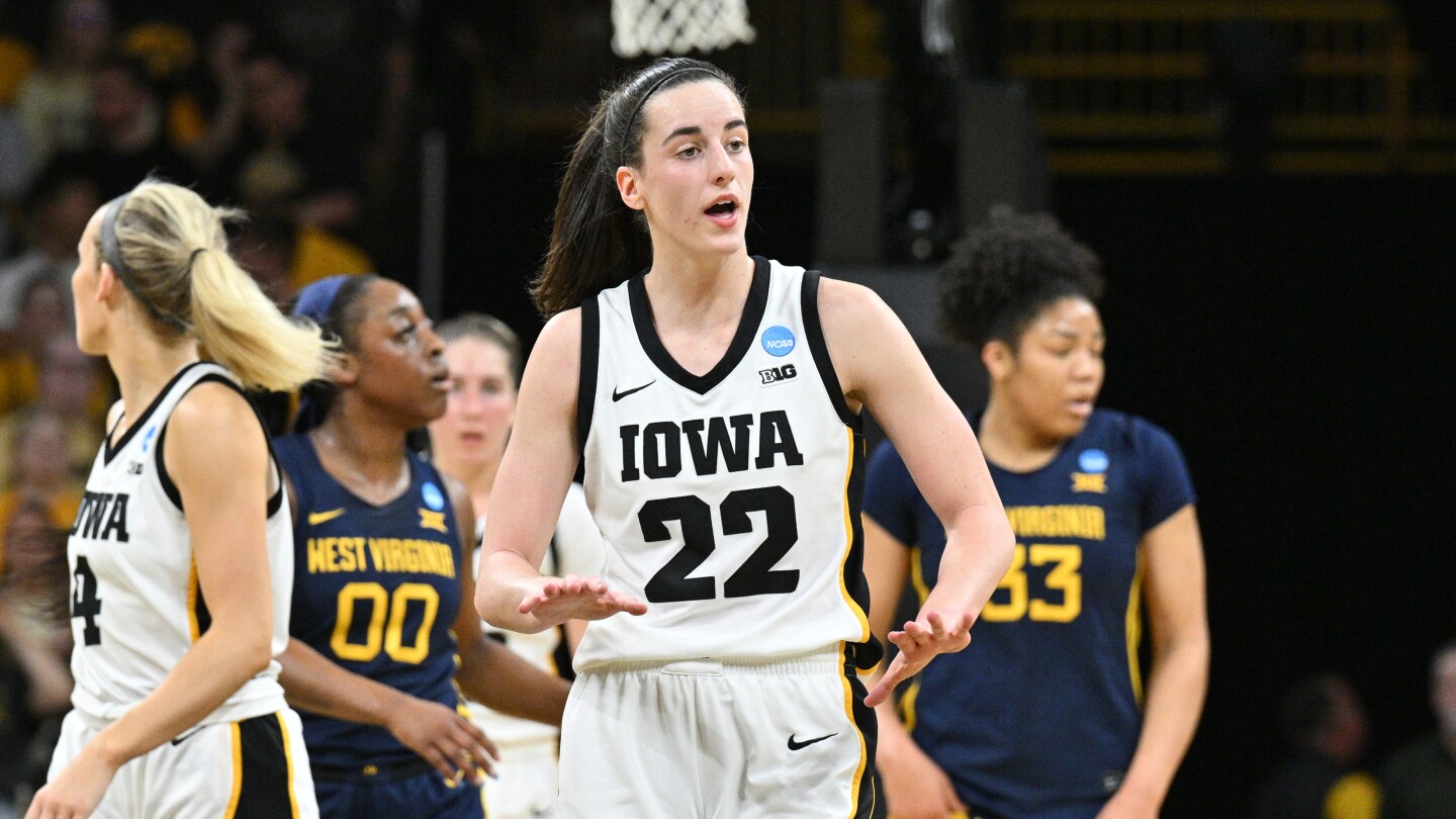Clark scores 32 as top seed Iowa survives to top West Virginia, 64-54