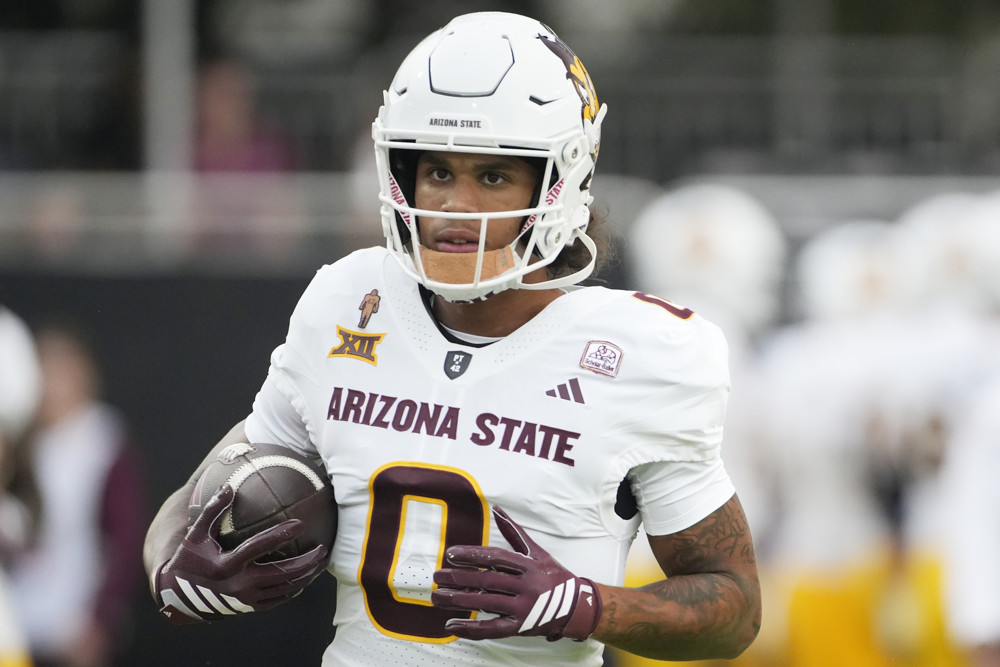 Jordyn Tyson carries the ball to get featured in the 2026 Dynasty Rookie Big Board Rankings for the incoming rookie class