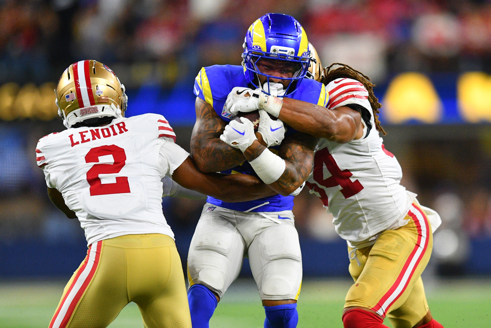 Kyren Williams featured in Week 6 Fantasy Football Player Rankings Tiers Start Sit QB RB WR TE splits two 49ers defenders on his way to a 1st down.