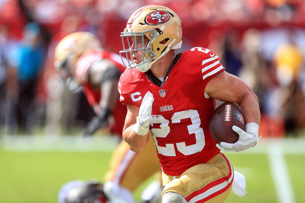 Christian McCaffrey rushes for the November Dynasty Fantasy Football Calendar