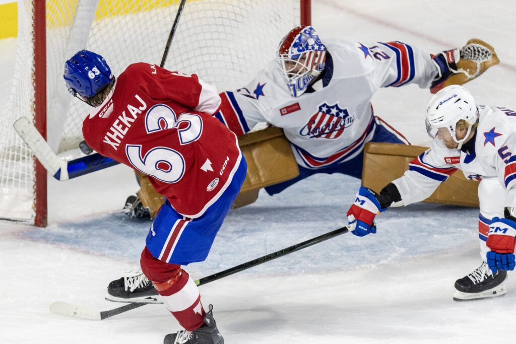 "I feel like I definitely did need the games in the AHL," says goalie Devon Levi, making a paddle save for the Rochester Americans on a shot by Rocket forward Florian Xhekaj during AHL playoff game in Laval on May 21, 2025.